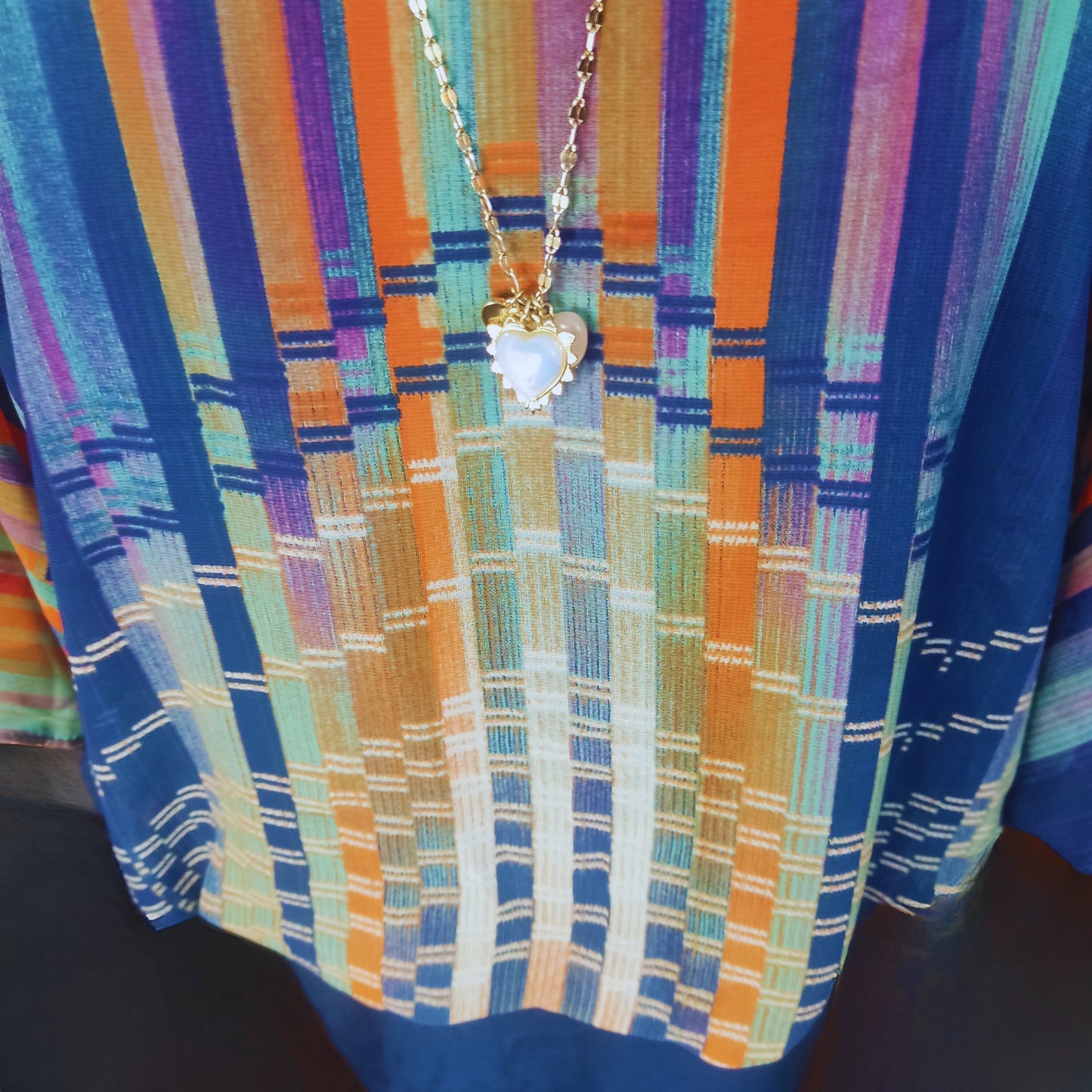 Blusa con patrón de rayas horizontales tonos naranja azul y turquesa cod. 4000022